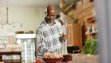 senior african american man shopping at health food shop, slow motion