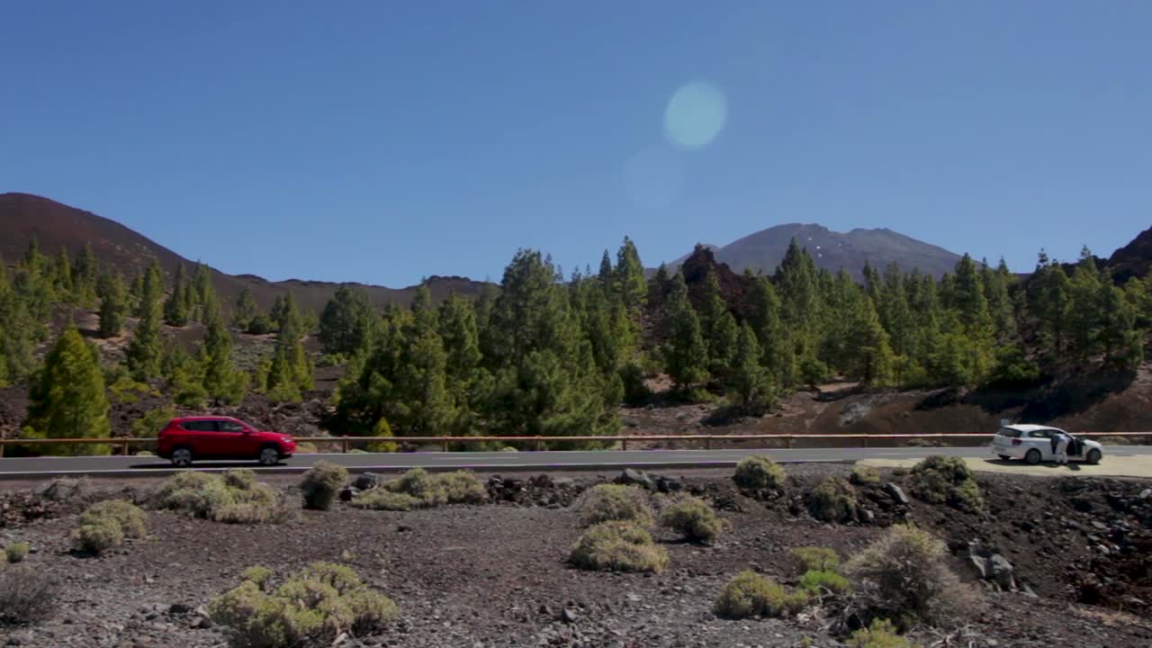 Shot of car passing through a road in the Teide National Park