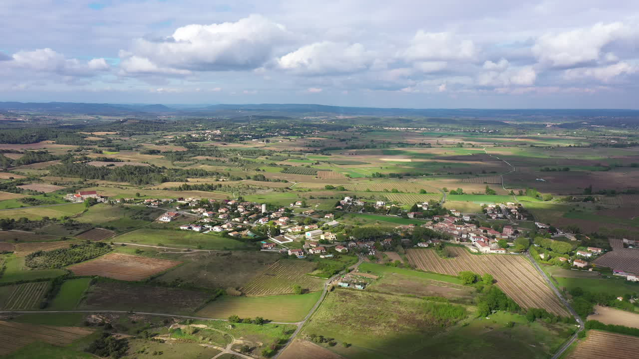 Beautiful rural aerial drone shot over Campagne village vineyards and crop field