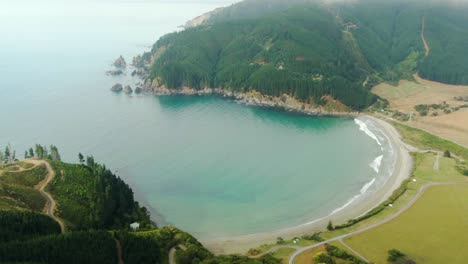 A-hidden-bay-of-clear-blue-water-surrounded-by-forest-hills