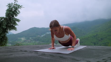 woman exercising outdoors in mountains