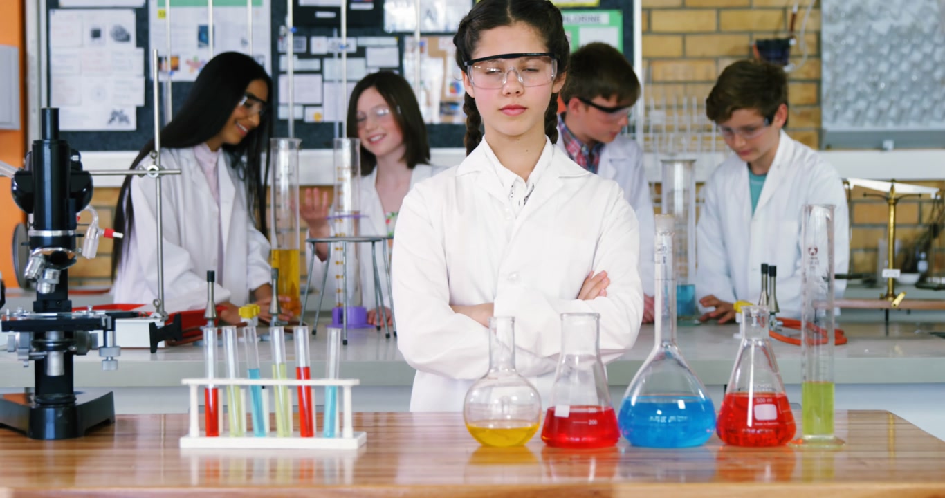 Animation of back to school text over diverse students at science class