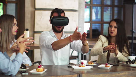 team of developers working with virtual reality glasses during a business meeting. young business colleagues brainstorming using vr goggles