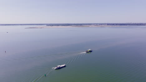 An elegant Dutch Luxemotor vessel cruising gently under the bright summer sun in Flevoland