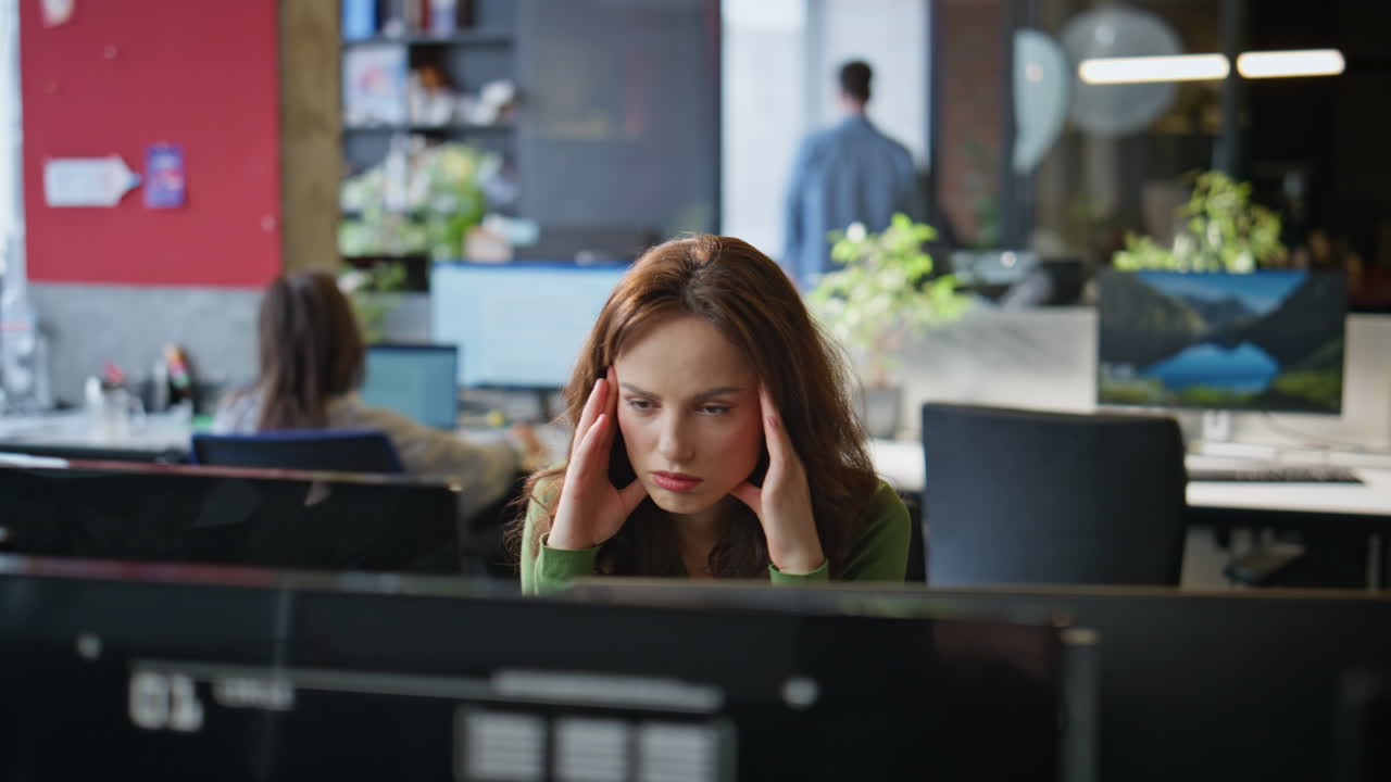 Serious director working computer thinking decision in office interior closeup