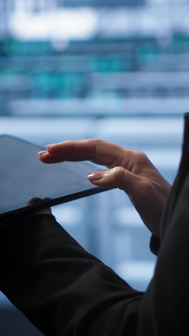 Close-up of Person's Hands Using a Digital Tablet