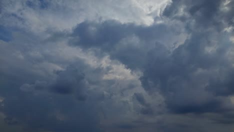 storm clouds coming - 4k time-lapse footage, billowing dark clouds on the sky
