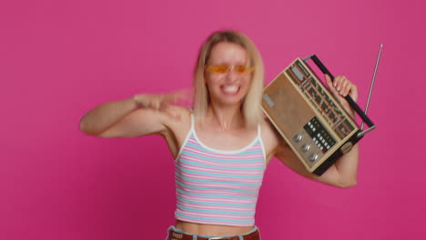 Happy-woman-listen-music-on-retro-tape-record-player,-disco-dancing,-fan-of-vintage-technologies