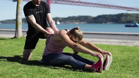 Side-view-of-blonde-woman-warming-up-before-workout.