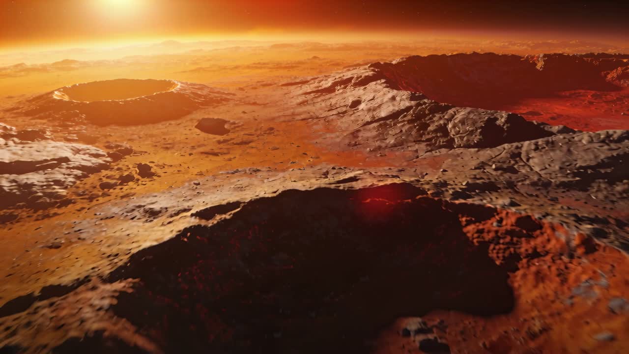 La telecamera avanza, rivelando un bordo in primo piano, un profondo bacino su una pianura rossa sotto il sole basso, con un bagliore dell'obiettivo.