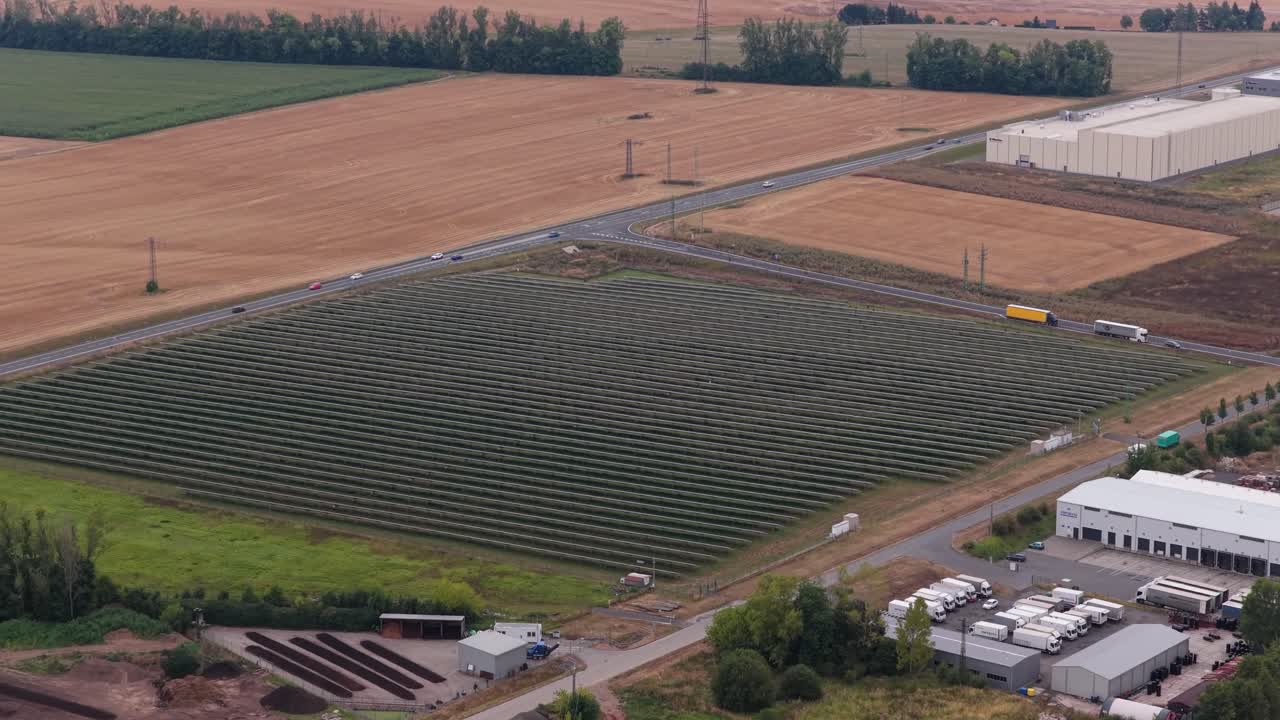 Large area of solar panels filling an empty space in the city. Energy collected from the sun, view from a drone