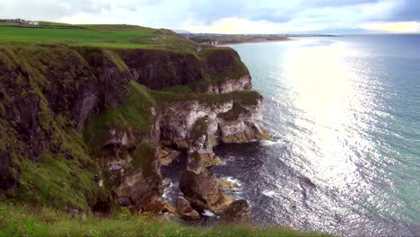 view of rocky green top cliffs and ocean in ireland