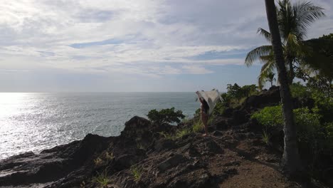 Drone-shot-flying-over-coast-of-Costa-Rica-with-beautiful-young-woman