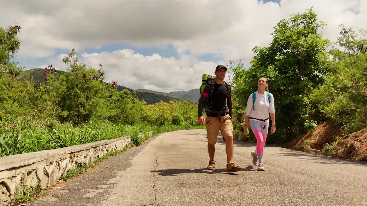 Couple Hiking on Mountain Road