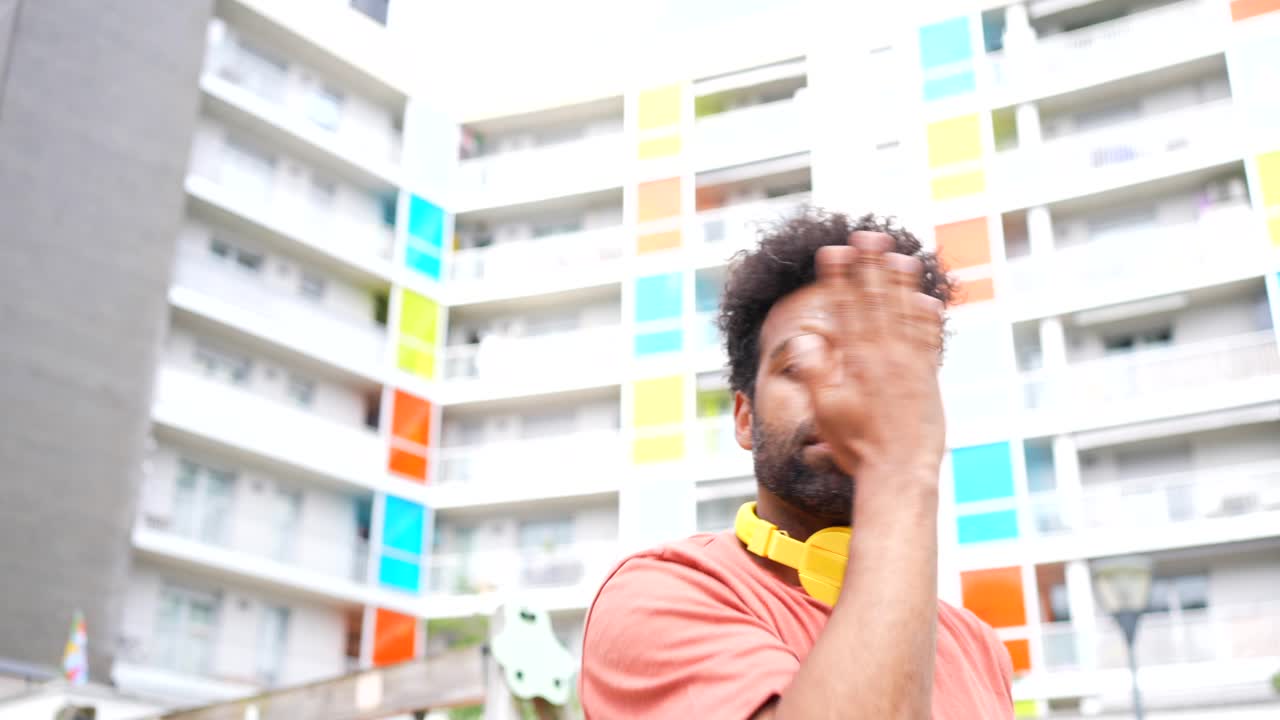 Man with headphones in an urban setting