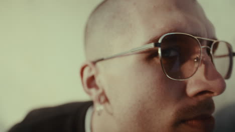 close-up portrait of man wearing glasses