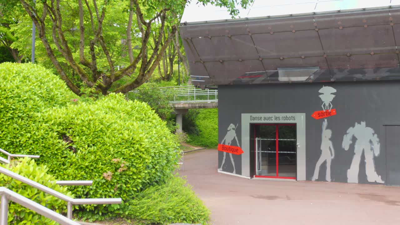 Exterior view of a building with robot artwork