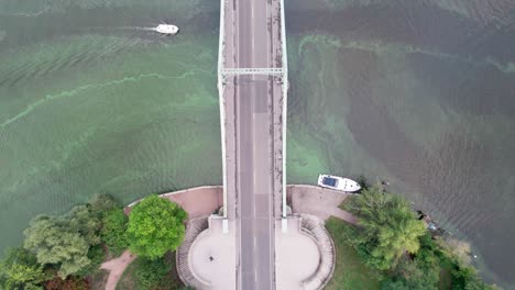 flying backwards over bridge with boat going underneath