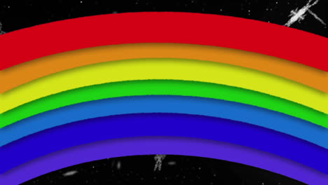 animation of rainbow over falling snow on black background