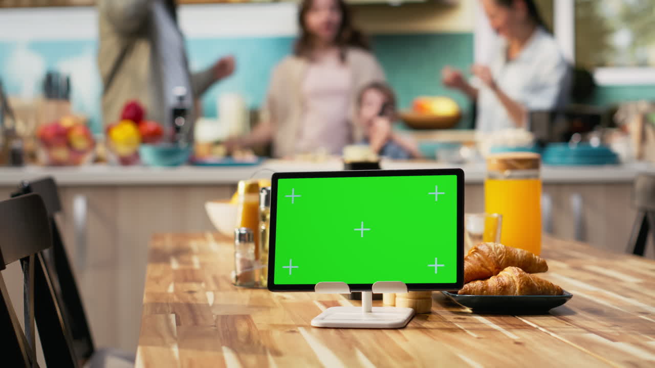 Mockup screen on tablet with young family having fun during weekend activity