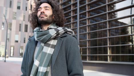 businessman in elegant casual clothes looking away in epic pose at the financial district