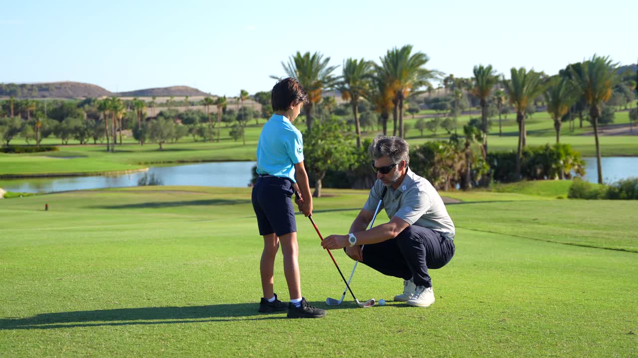 Father and Son Golfing on a Sunny Day