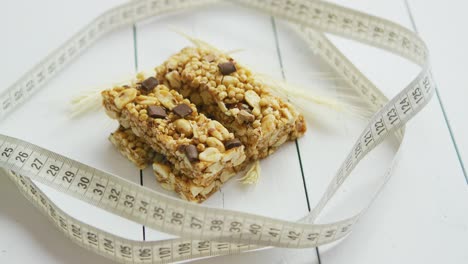 granola bars with dried fruits wooden background