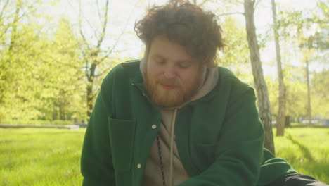 man and dog enjoying a sunny day in the park