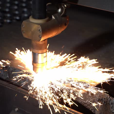 plasma cutter. plasma robotic industrial equipment works with metal sheet.