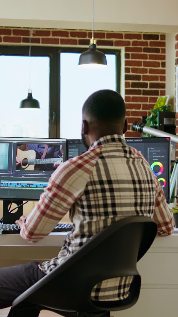 Vertical Video African american freelancer editing a background video at his home office