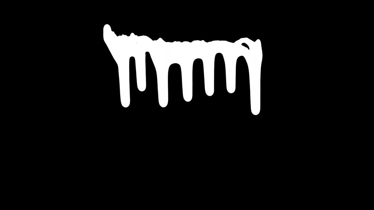 tinta blanca goteando sobre el fondo negro de la pantalla