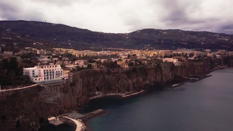 aerial view of the coastal town of sorrento in italy at sunset or sunrise, a beautiful landscape of houses near the bay of naples