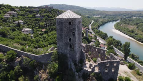 aerial: počitelj citadel overlooks neretva river, bosnia and herzegovina