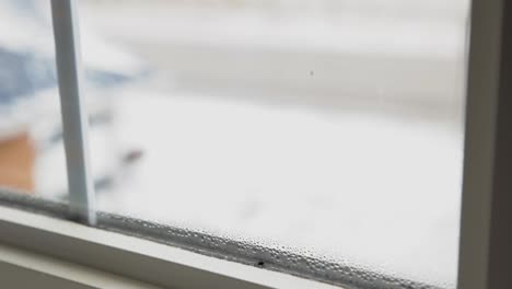 a frosted window after a fresh snowfall