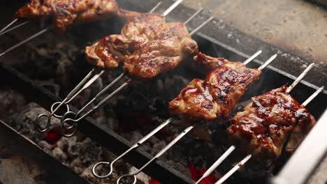 grilled chicken skewers on a charcoal grill