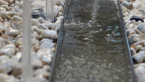 water fountain flowing on rocks