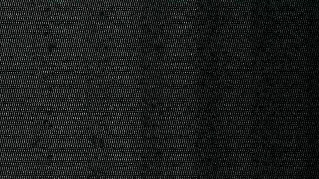 Detail textury tmavě šedé látky