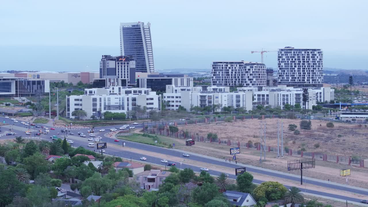 Modern mall buildings and high-rises in Midrand’s Mall of Africa township