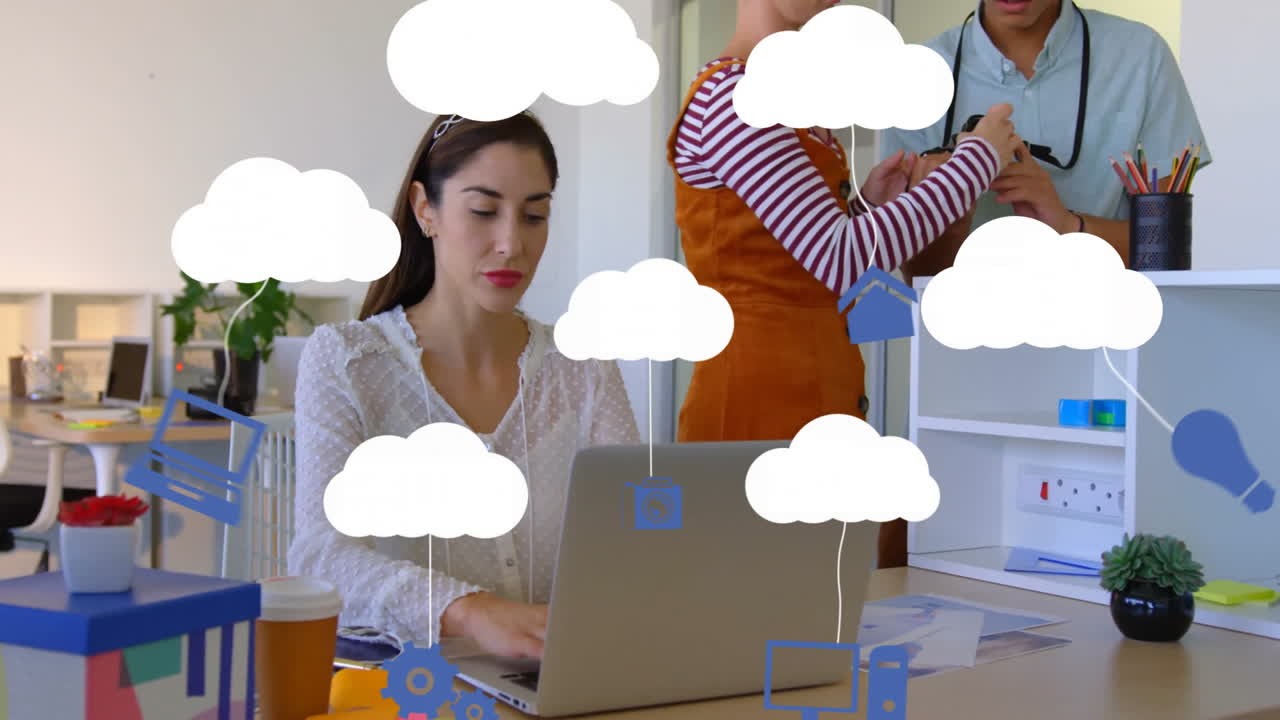 Using laptop, businesswoman working with cloud computing animation in office