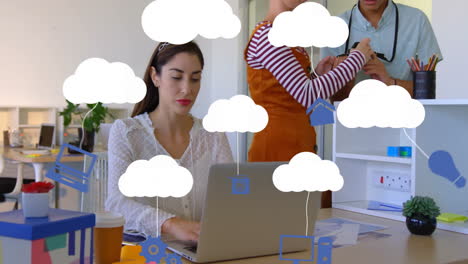 using laptop, businesswoman working with cloud computing animation in office