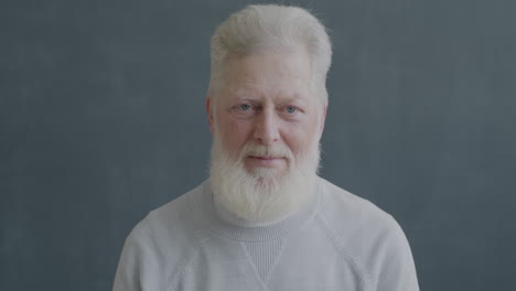 elderly man showing dislike