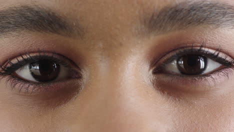 close up african american woman eyes looking happy expression wearing makeup cosmetics female beauty