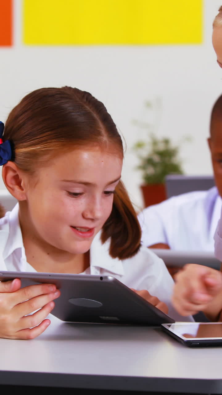 Students using digital tablet in classroom | Premium Stock Video Footage