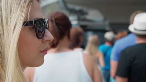 Attractive-woman-stands-in-long-queue-to-ride-rope-way