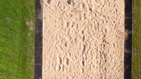 female athlete long jump and running on track