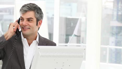 charismatic businessman calling by phone