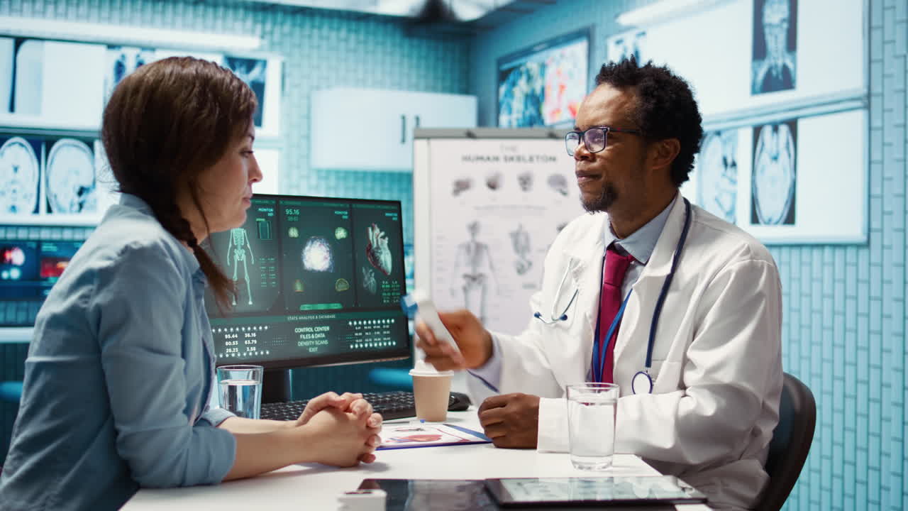 African american specialist consulting a young woman in medical office