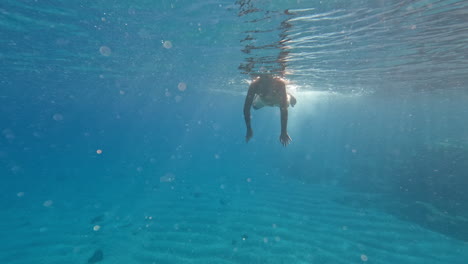 teenager dives underwater