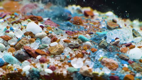 captivating close-ups of colorful pebbles and granules: a detailed exploration of various textures and shapes in an aquatic environment