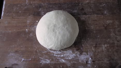 Fresh-Bread-Cakes-Knead-Dough-Balls-covered-with-cloth-over-the-wood